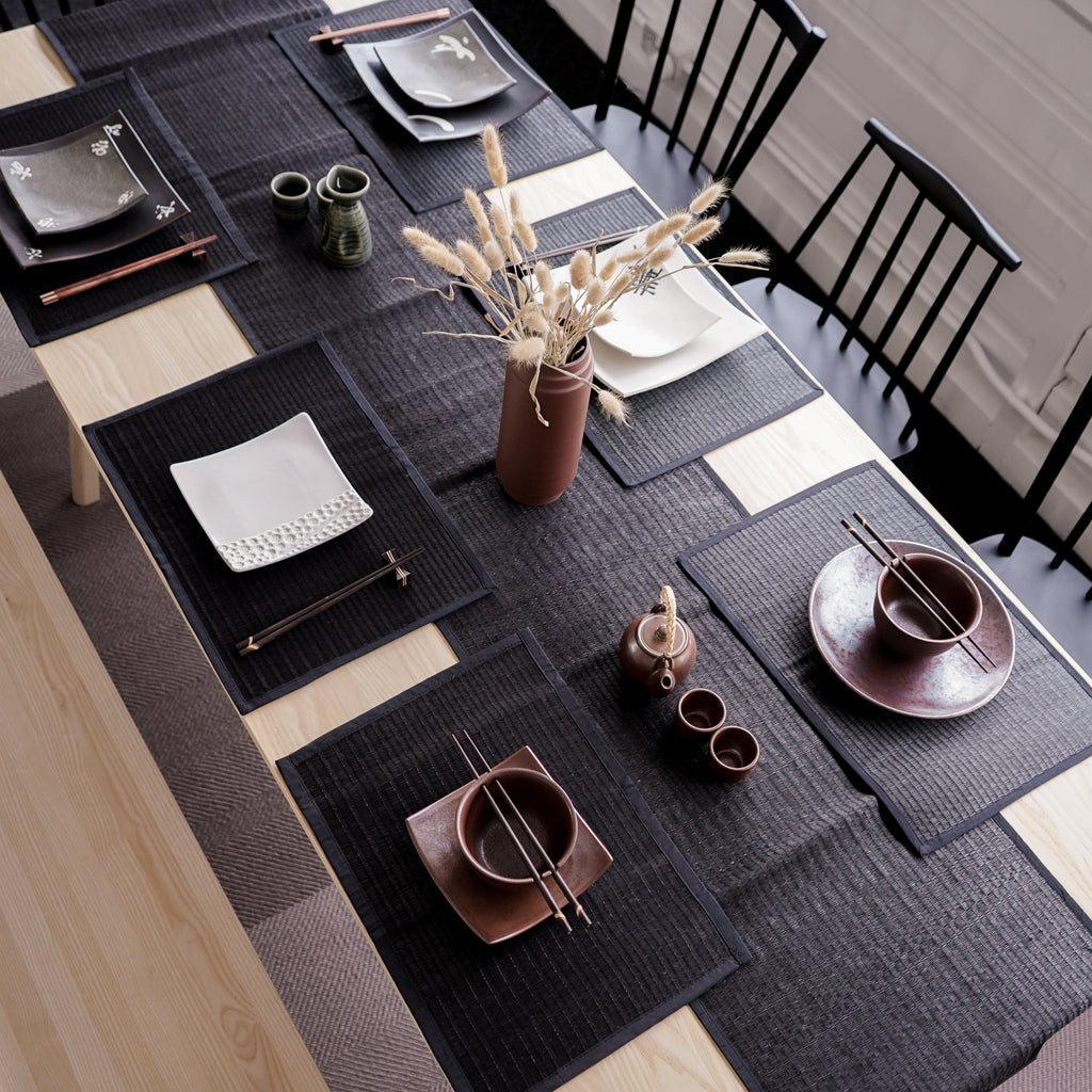 Table runner is the master piece on the dining table. Creating a modern, yet authentic style and character to the table with this black reed table runner. Handmade and hand woven with the finest quality reeds giving it beautiful and natural touch. Smooth the edge with a cotton trim. Perfect for a long table for 6-8 people. 