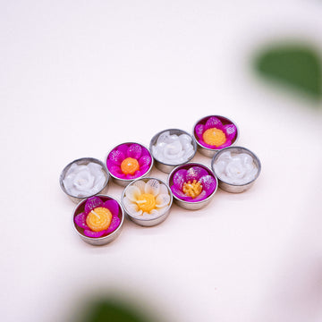 Add some glitter to the day with these beautiful assorted glitter flower scented tealights. The combination of white, pink and yellow with a dash of glitter powder creates joy and fun vibes. Scented with Neroli essential oil a sweet, honeyed and relaxing. Come in 8 assorted glitter flower tealights in a botanical garden design box. They can be used with any standard tealight holders.