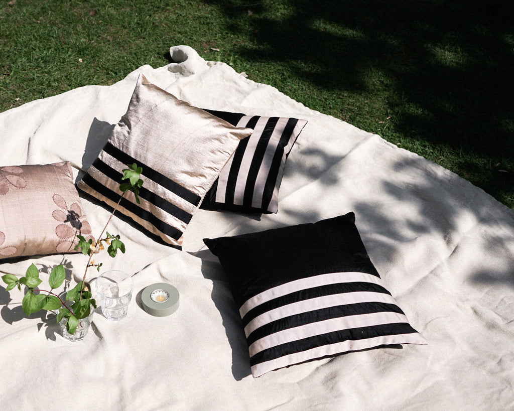 Minimalist and elegant are called for this silk cushion. The plain black silk with cotton stripes across the body give a contemporary and classic look to the cushion itself and to the room.   Thanks to its standard size which can be used with most of the cushions in your home.  Cushion cover size 40 x 40 cm Cushion pad is not included